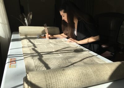 Alex repairing a Holocaust scroll